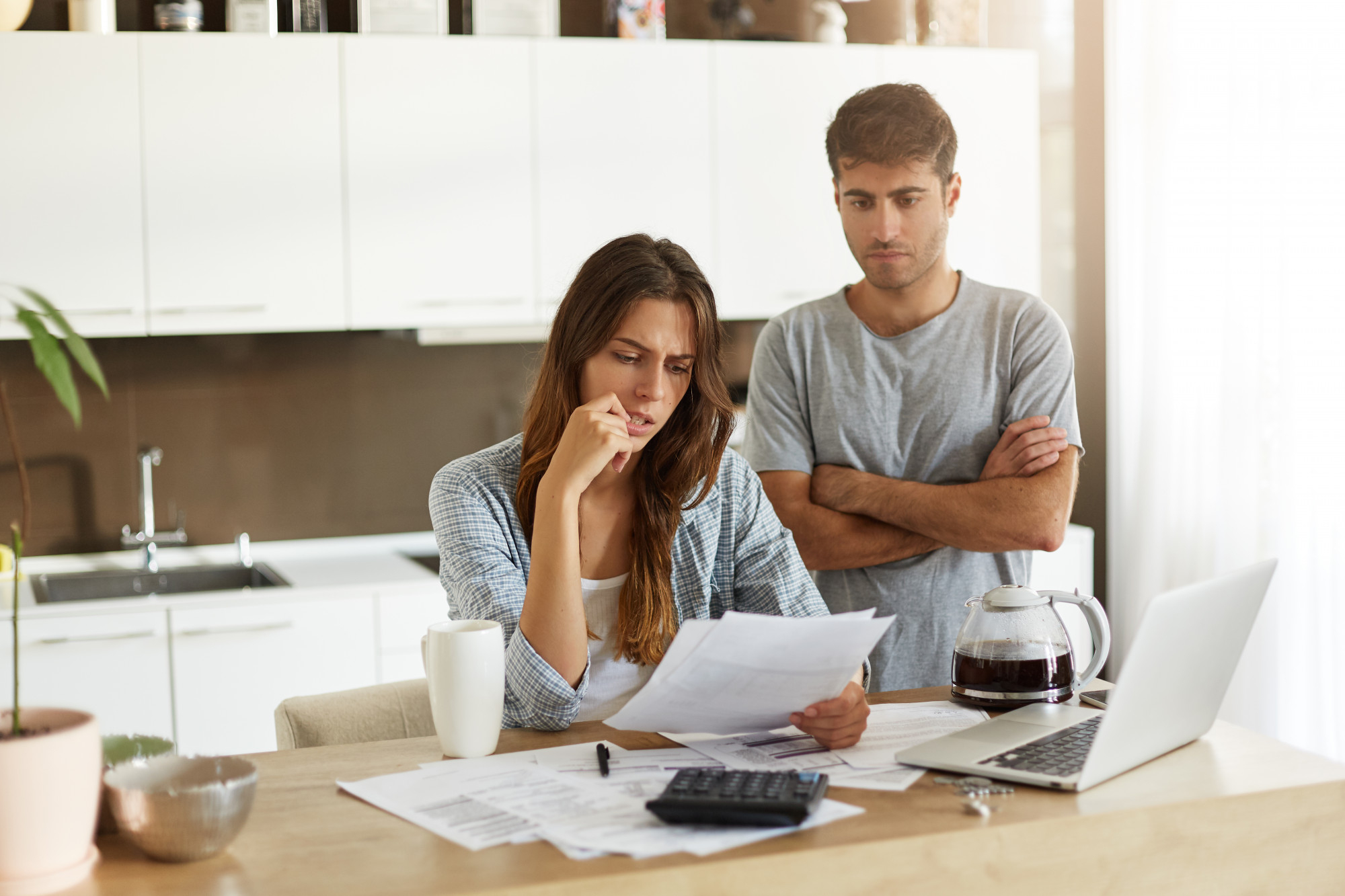 Couple reviewing vehicle finance and car instalment arrears